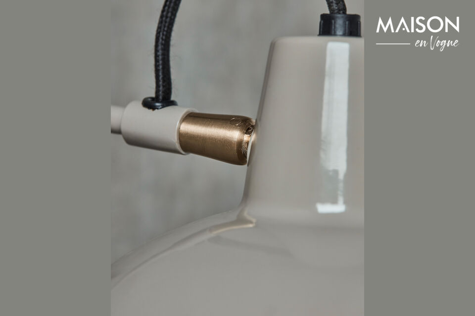 The industrial aesthetic, combined with a smooth enamel finish, makes it both modern and classic