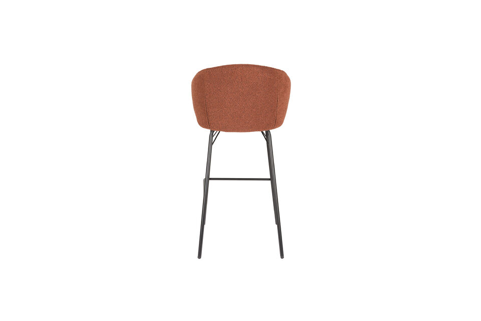 Made of bouclé fabric, this chair exudes elegance and quality