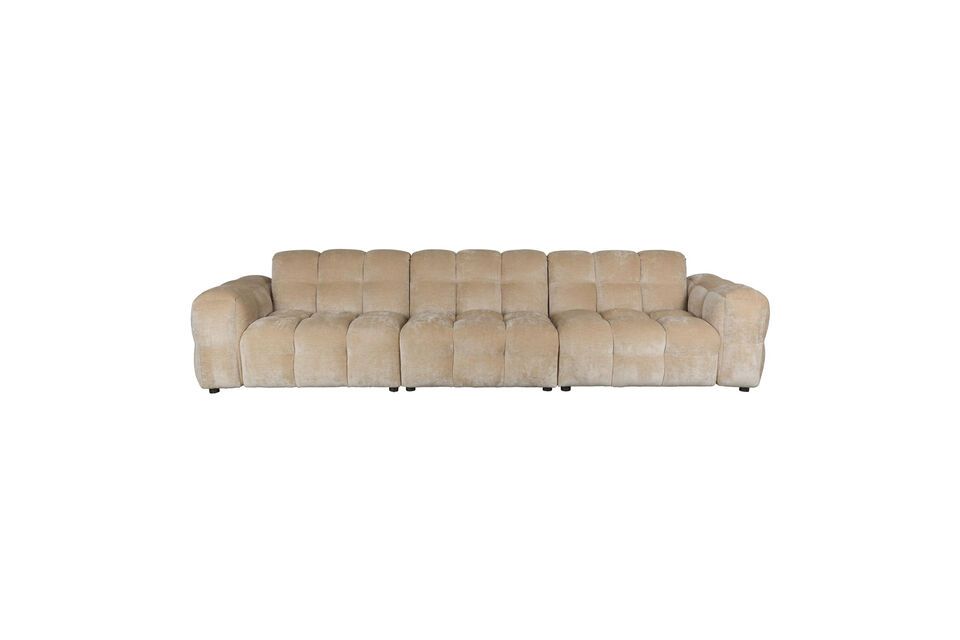 The soft texture of its covering is inviting, encouraging moments of relaxation and conviviality