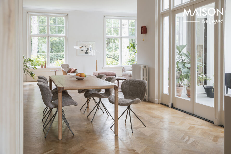 Its organic, rounded design, paired with the sleek legs, gives it a distinct appearance