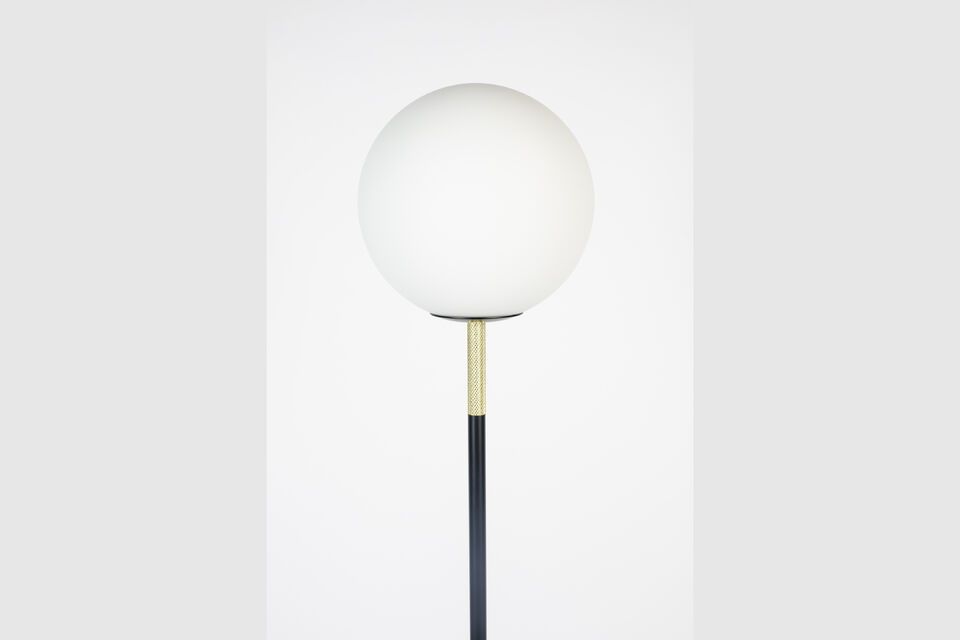 Its opal glass globe diffuses a soft