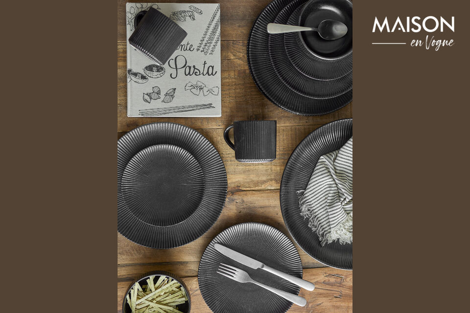 The Neri Bowl by Bloomingville is made of stoneware with a black glaze