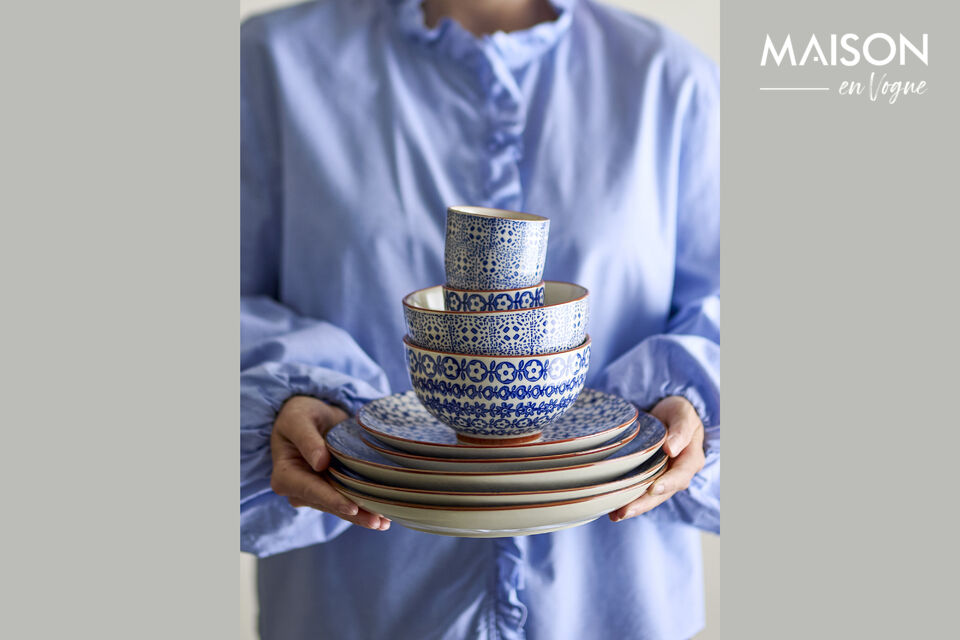 Each bowl is finished with a handpainted rim that adds a refined contrast to the patterned exterior