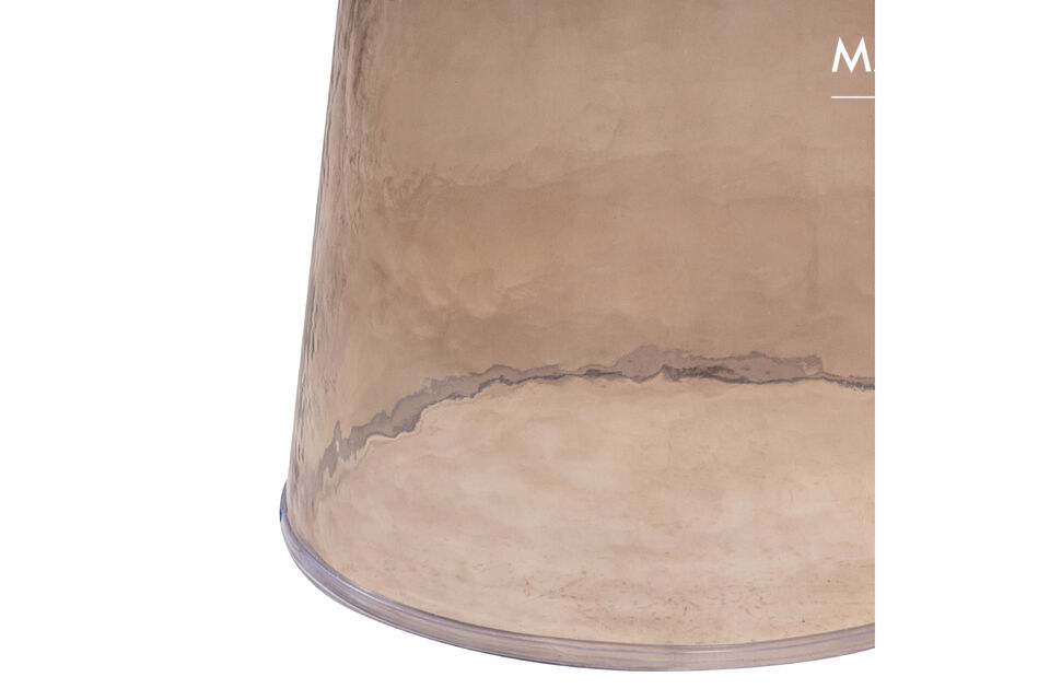Loma is completely manufactured from glass with a brown coloring that gives the side table a