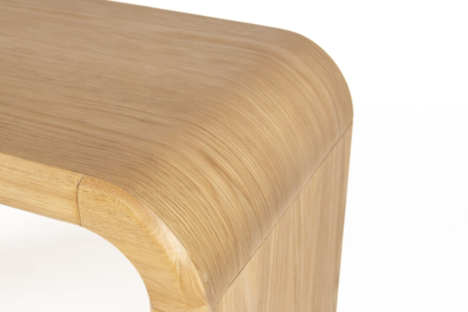 This wooden table effortlessly elevates the ambiance of your living space