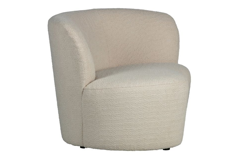 Les formes douces et arrondies et le tissu confortable font de ce fauteuil un endroit idéal pour