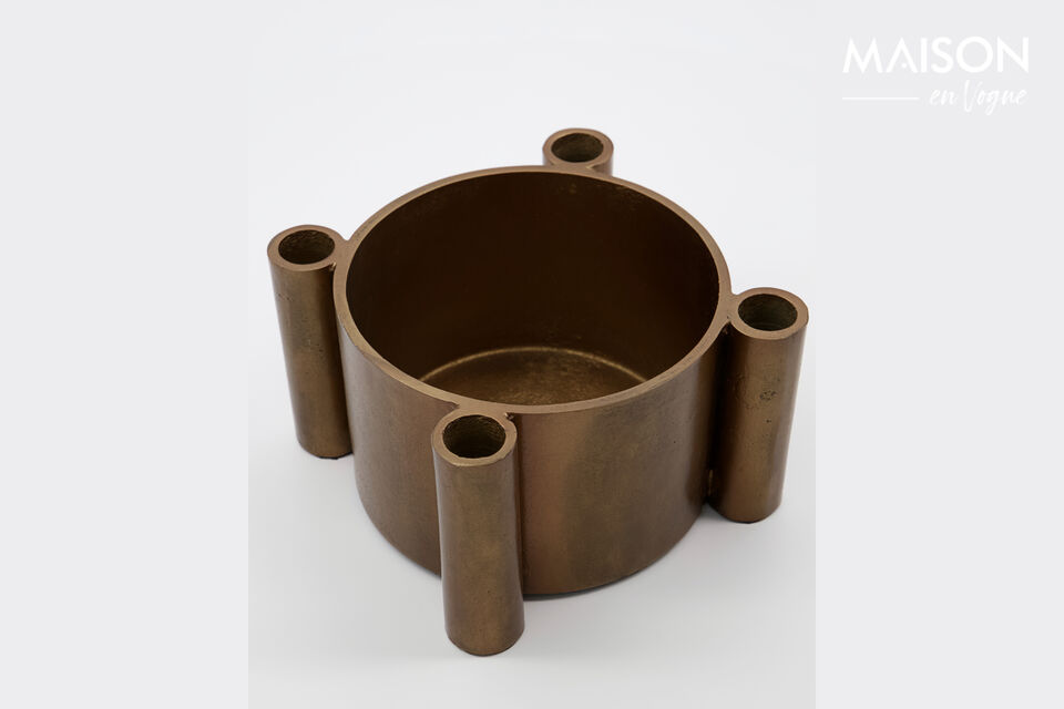 The aluminium has been given a surface with a slightly rugged finish give the round candle holder a