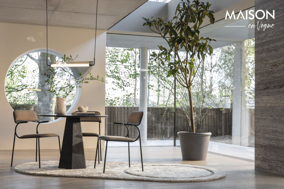This dining chair features a curved metal frame with a soft velvet seat