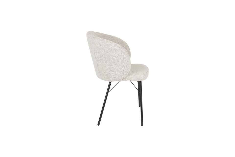 Fabriquée en tissu bouclé, cette chaise respire l\'élégance et la qualité