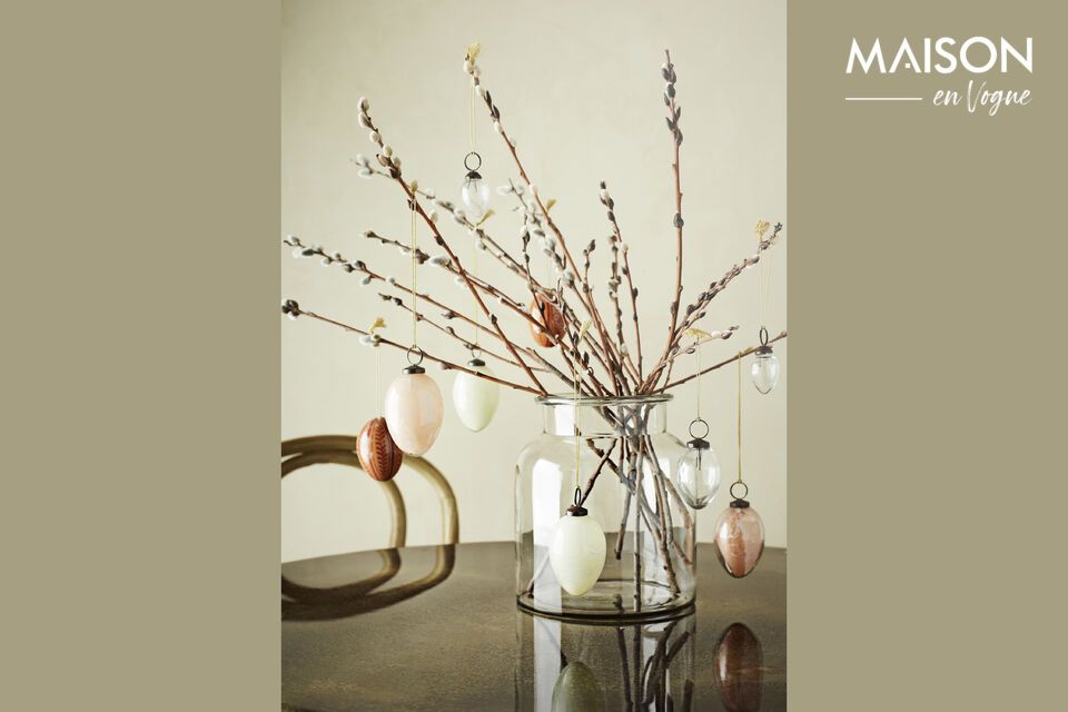 Invite charm and tranquility into your home with this handcrafted vase
