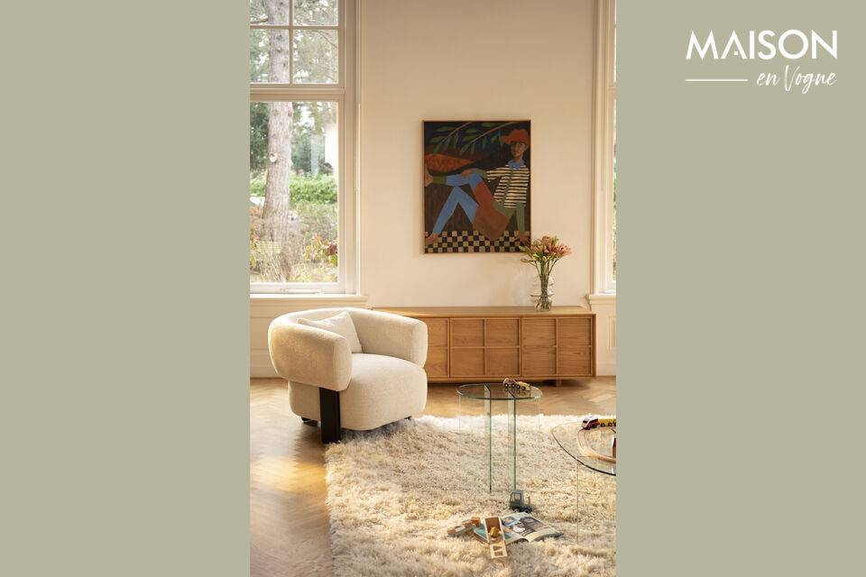 This generous piece of furniture is designed with striking rounded shapes that create a strong yet