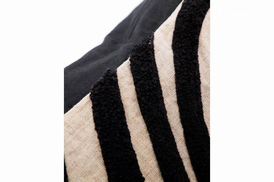 The HDSky cushion is handmade from a cotton and linen blend with a graphic embroidered black and