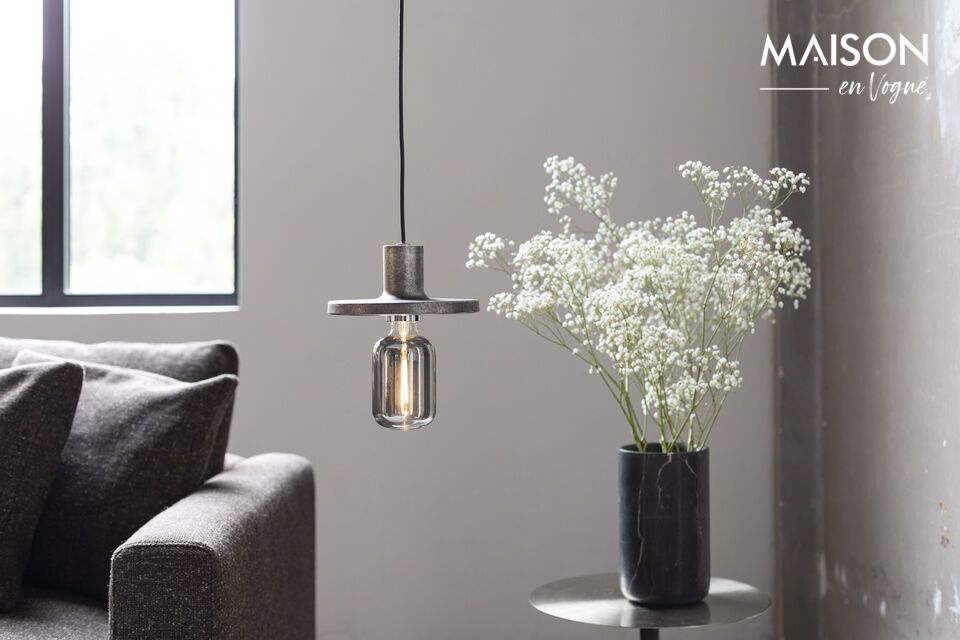 The sophisticated simplicity of the smoked black glass highlights the decorative filament