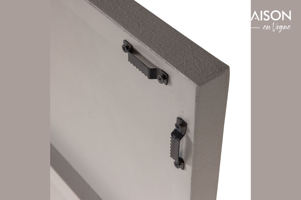Material Die Numa Wanddeko ist aus Metall mit einem grauen Beton-Look gefertigt