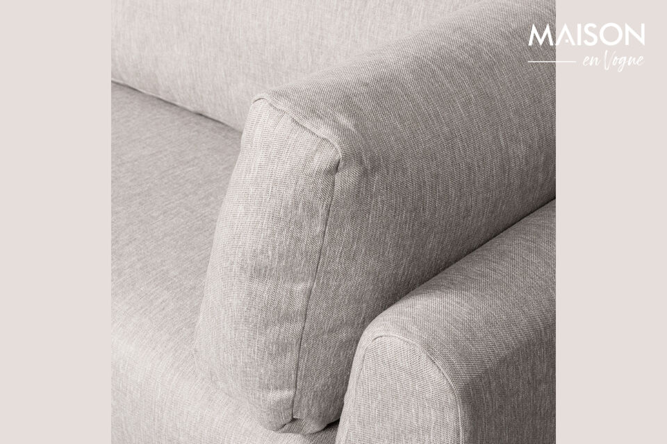 The sophisticated design is highlighted by high, black cylindrical legs