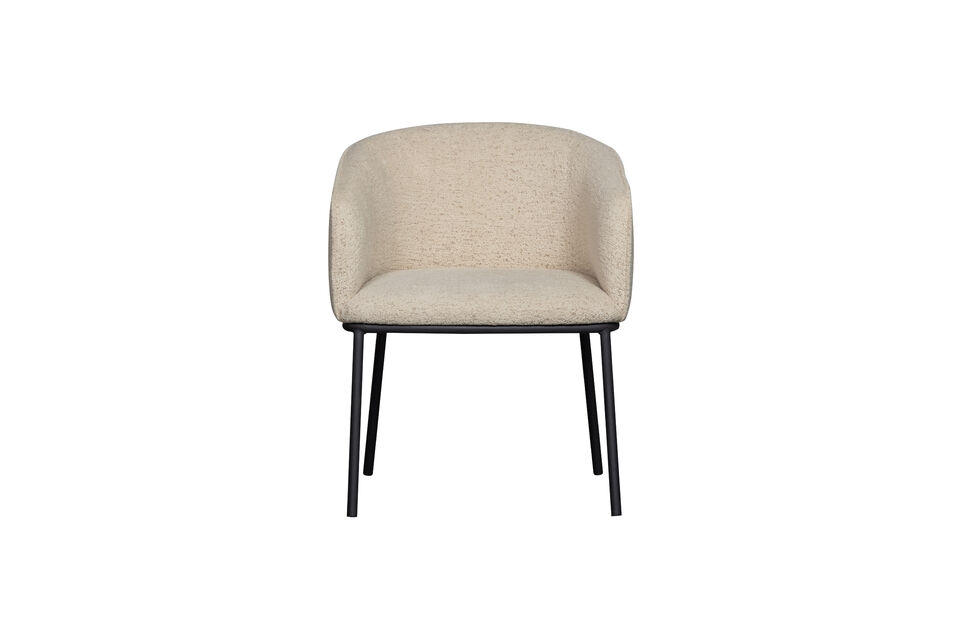 The tapered metal leg gives the chair an airy look