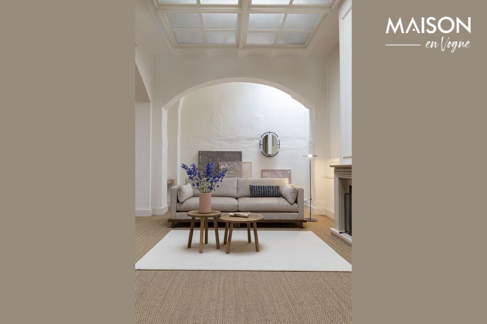 Il divano Blossom poggia su una base in rovere massiccio tinto noce