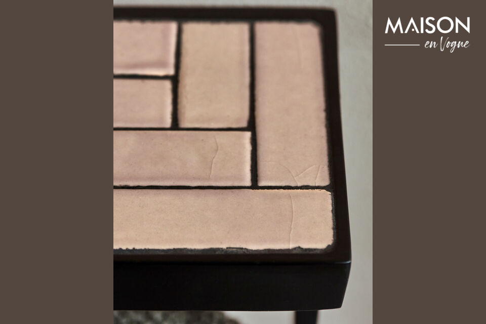 Featuring sand-coloured tiles within a sleek black aluminium frame