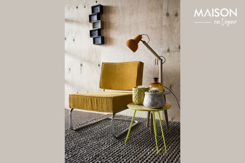 Un fauteuil confortable associant les styles vintage et industriel