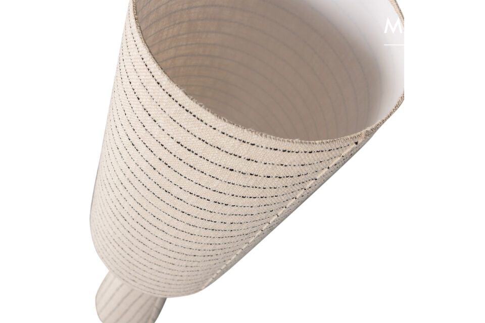 The soft bouclé fabric adds warmth and atmosphere