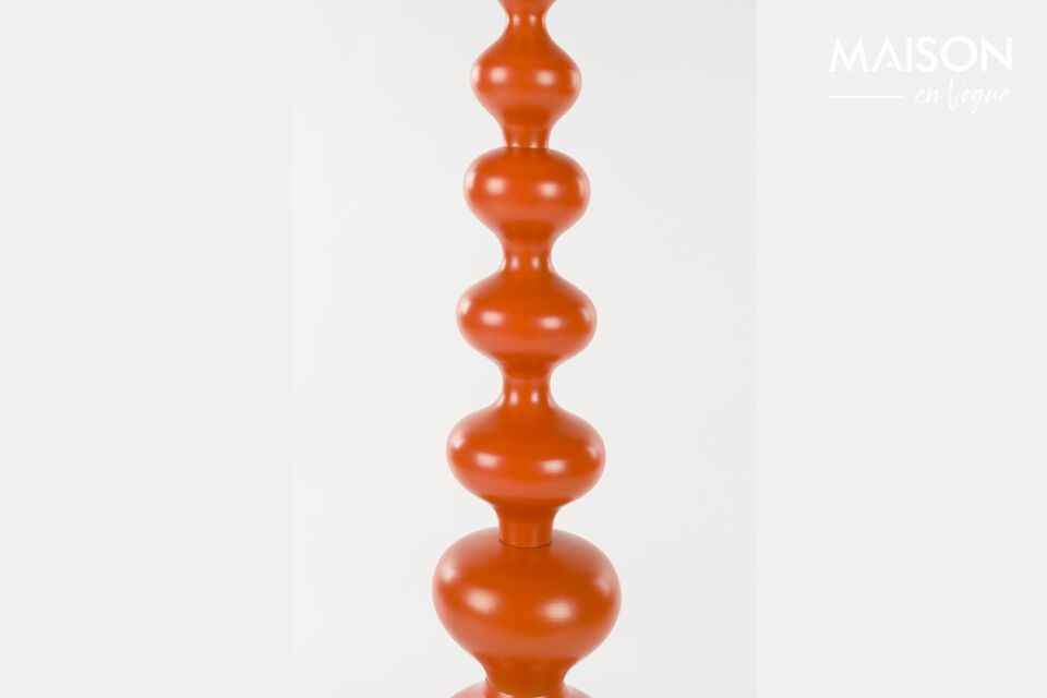 This eye-catching lamp combines playful shapes with a vibrant orange hue