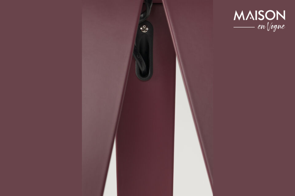 Stylish red iron tripod floor lamp offering warm, modern ambient lighting