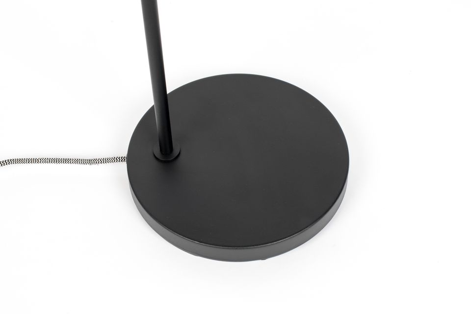The base and the body of the floor lamp are in black painted iron while the lampshade itself is in