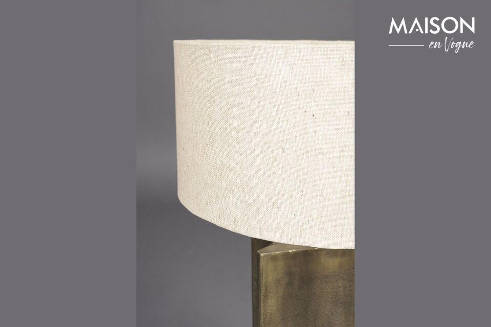 The Rico golden aluminum table lamp quickly becomes the heart of a warm ambience
