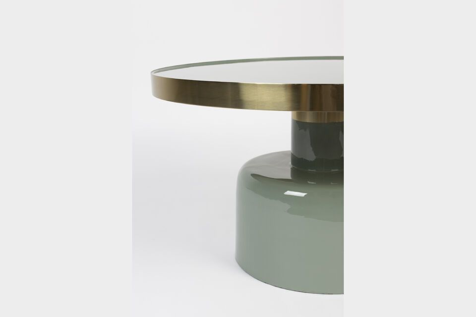 The table\'s high-gloss enamel surface and gold finish give it an eye-catching, luminous presence
