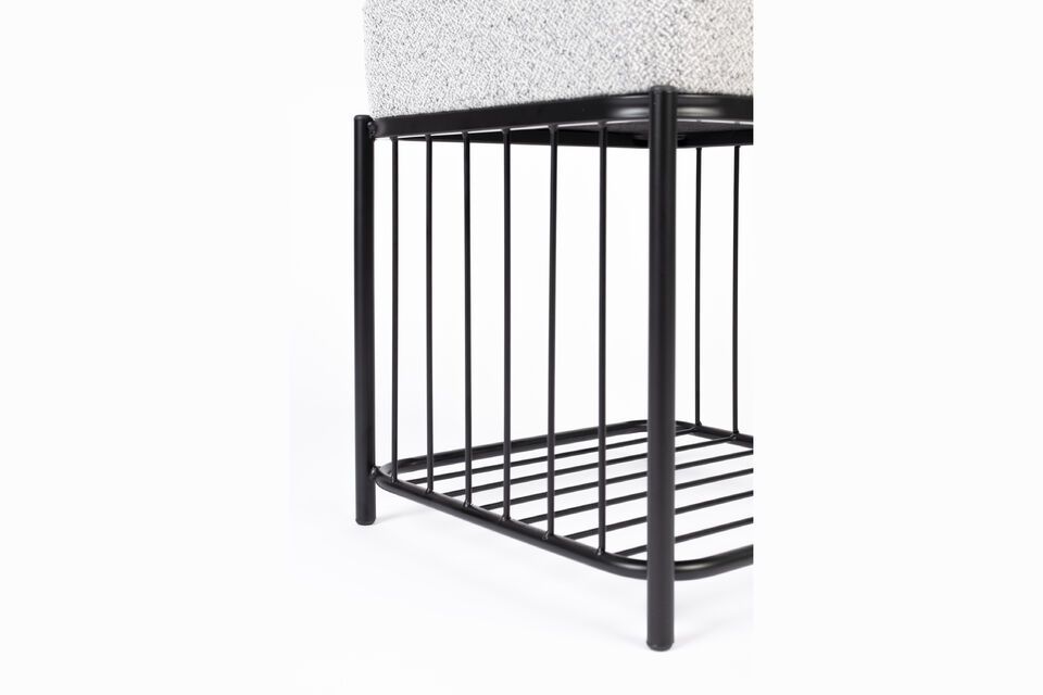 The stool\'s neutral color and sleek design make it an ideal choice for any decor