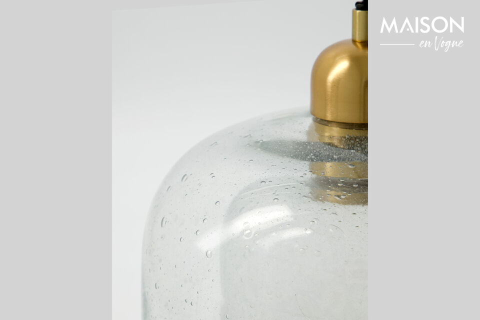 The organic silhouette and decorative metal top create a playful and modern look in any setting