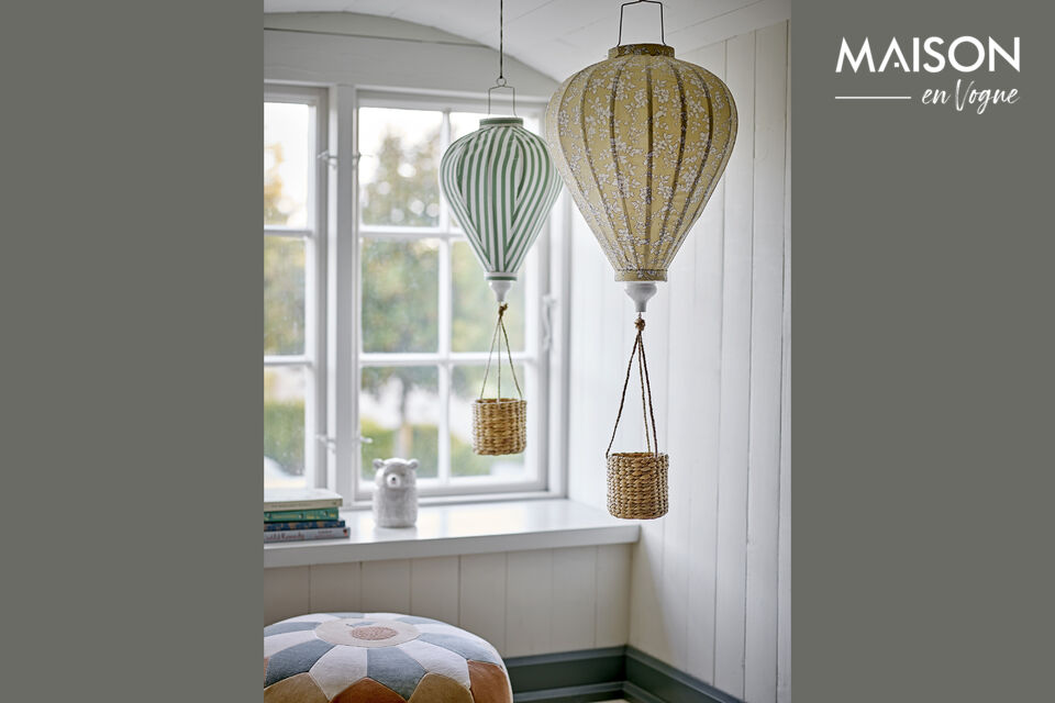 The Pomp Mobile by Bloomingville MINI is made of polyester in a soft yellow tone