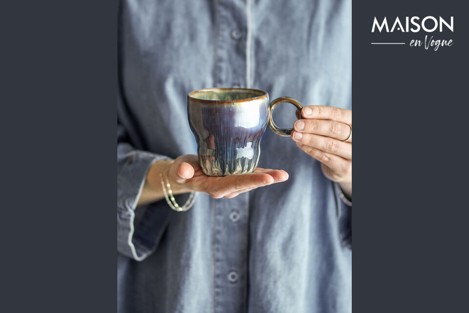 The Nigel Cup by Bloomingville is a set of 4 stoneware cups with a reactive glaze in blue and sand