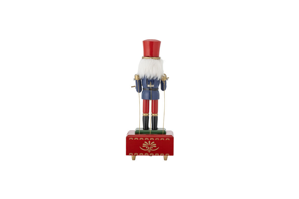 It is equipped with a wind-up mechanism that plays a melody while the arms drum mechanically