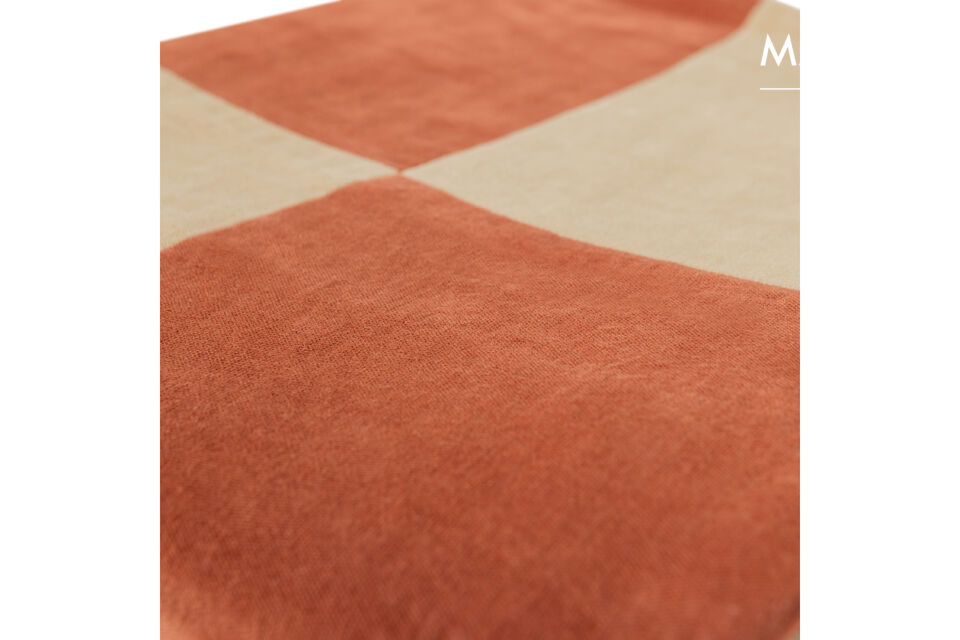The throw is made of 100% cotton and feels smooth and comfortable