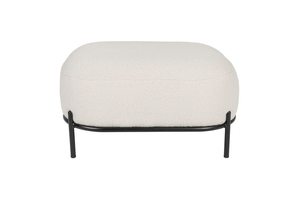 Este reposapiés está tapizado en un suave tejido beige