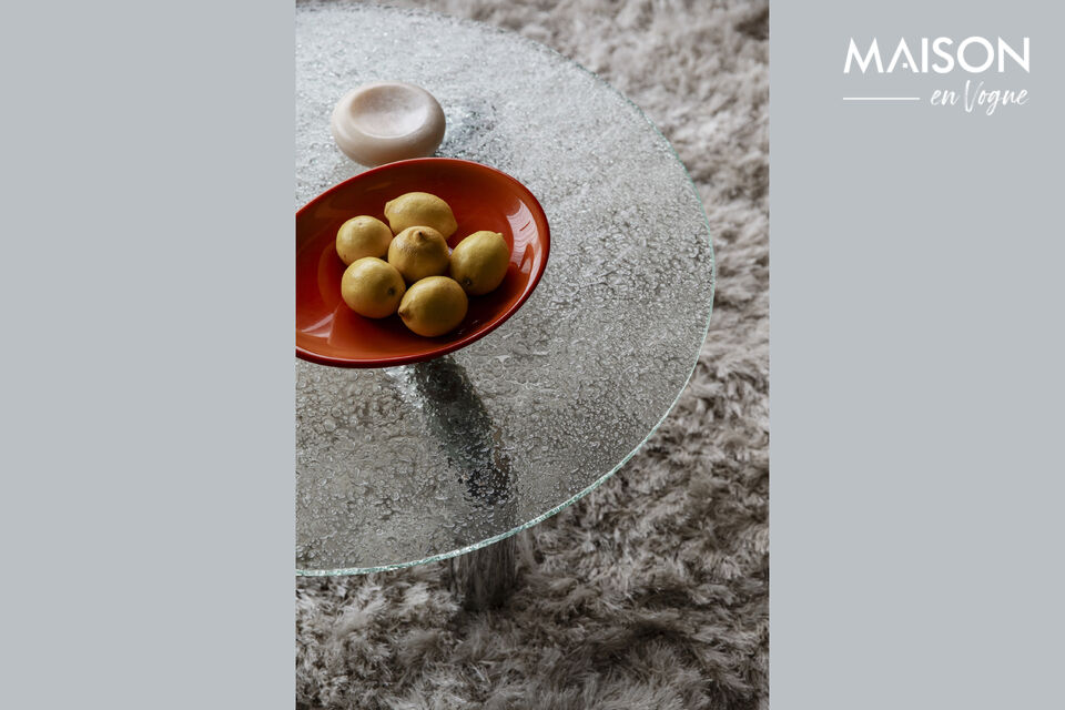The tables feature a round glass tabletop with a striking texture