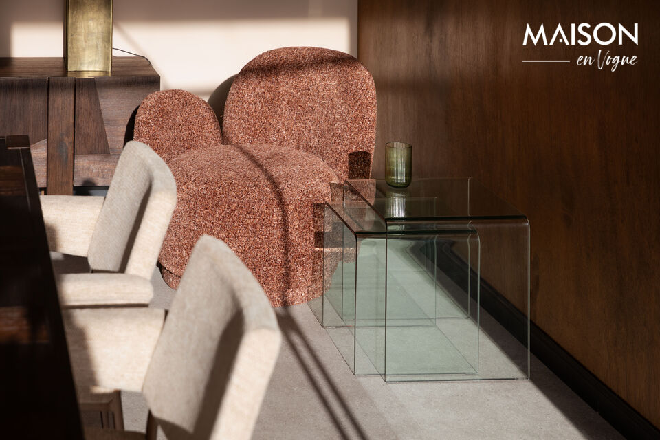 The furniture is made from clear glass that is smoothly curved from a single piece, without seams