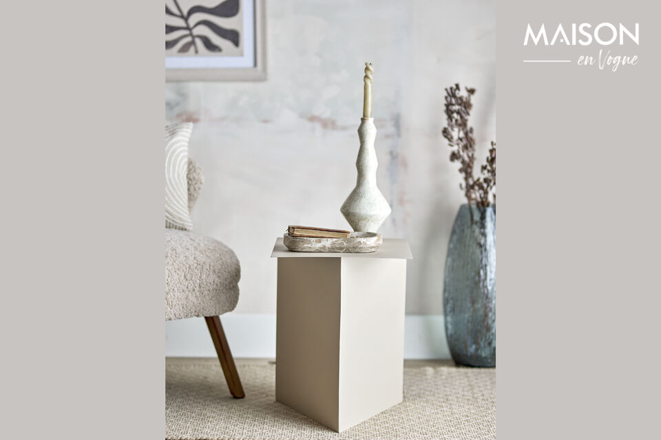 The Tasha Side Table by Bloomingville is made of lacquered metal and has a simple
