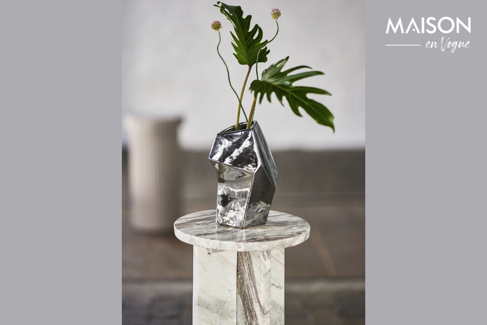 The Dimona Vase by Bloomingville is a silver colored stoneware vase with a plated finish that gives