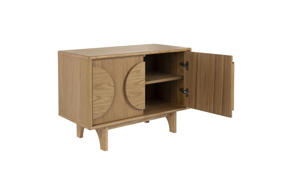 Adorned with circular wooden accents on its doors and elegant