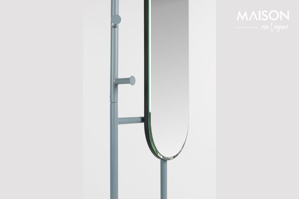On the right, you’ll find a large oval mirror with an elegant bevelled edge