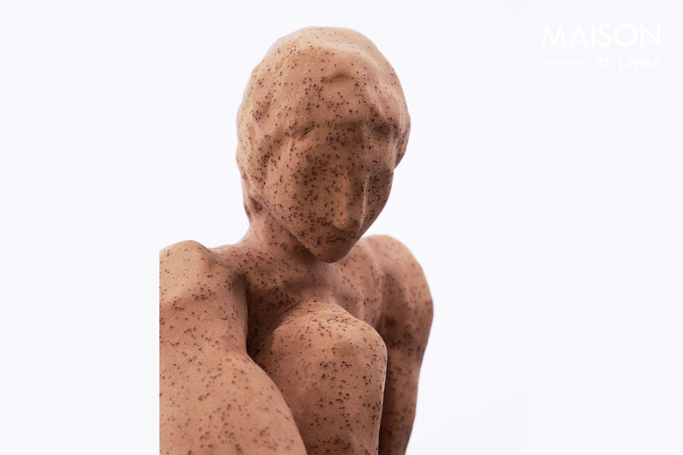 Give your interior a distinct artistic touch with this handcrafted stoneware figure in warm brown