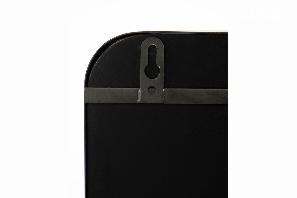 This charming mirror with a black antique steel frame adds a touch of minimalist elegance to any