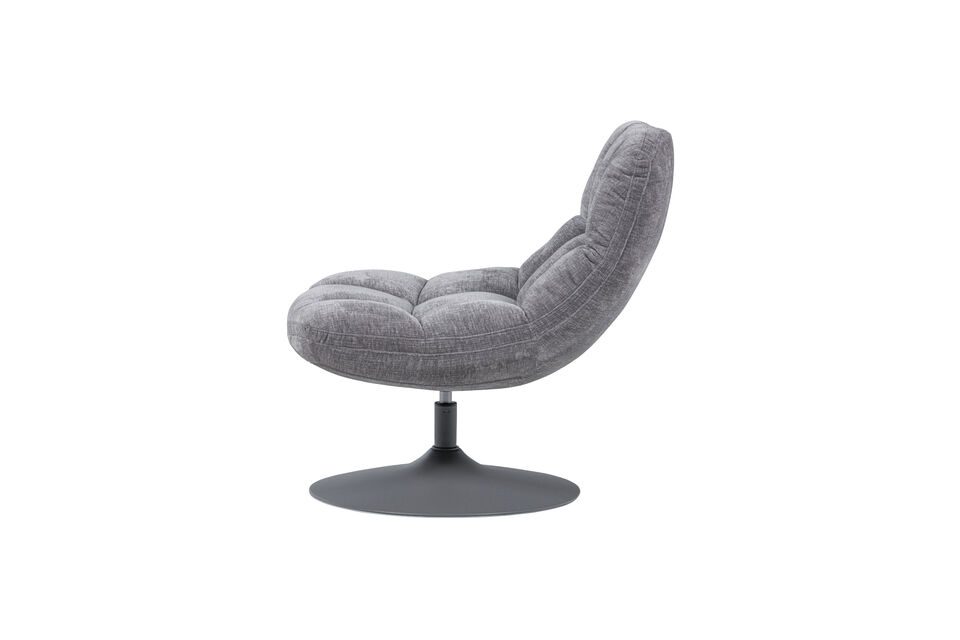 This elegant armchair from the collection of the Dutch brand WOOOD is upholstered in luxurious