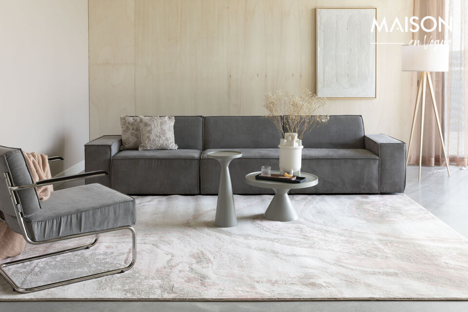Cette jolie petite table en aluminium repose solidement sur son pied et