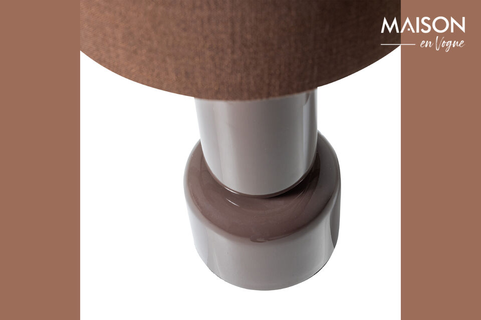 The fabric shade ensures soft light diffusion, immediately creating an atmospheric ambiance