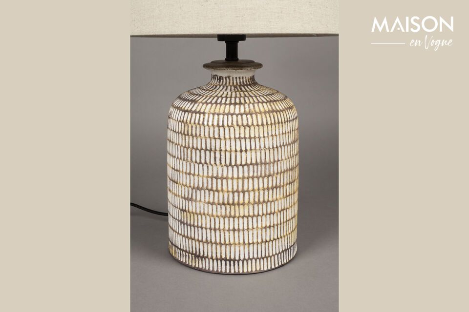 Discover timeless elegance and functionality with the Russel beige ceramic table lamp