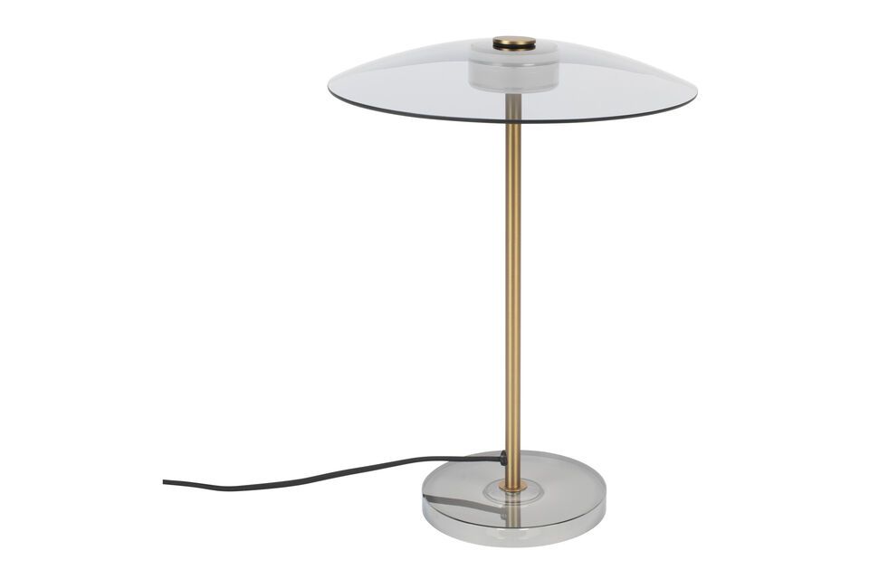 The Float Gilded Glass Table Lamp is a statement piece that reflects sophistication and style