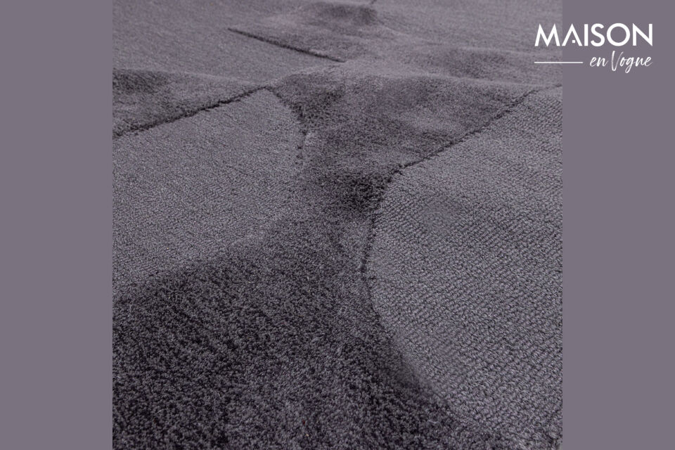 Ce tapis provient de la collection de la marque néerlandaise WOOOD et est composé à 55% de